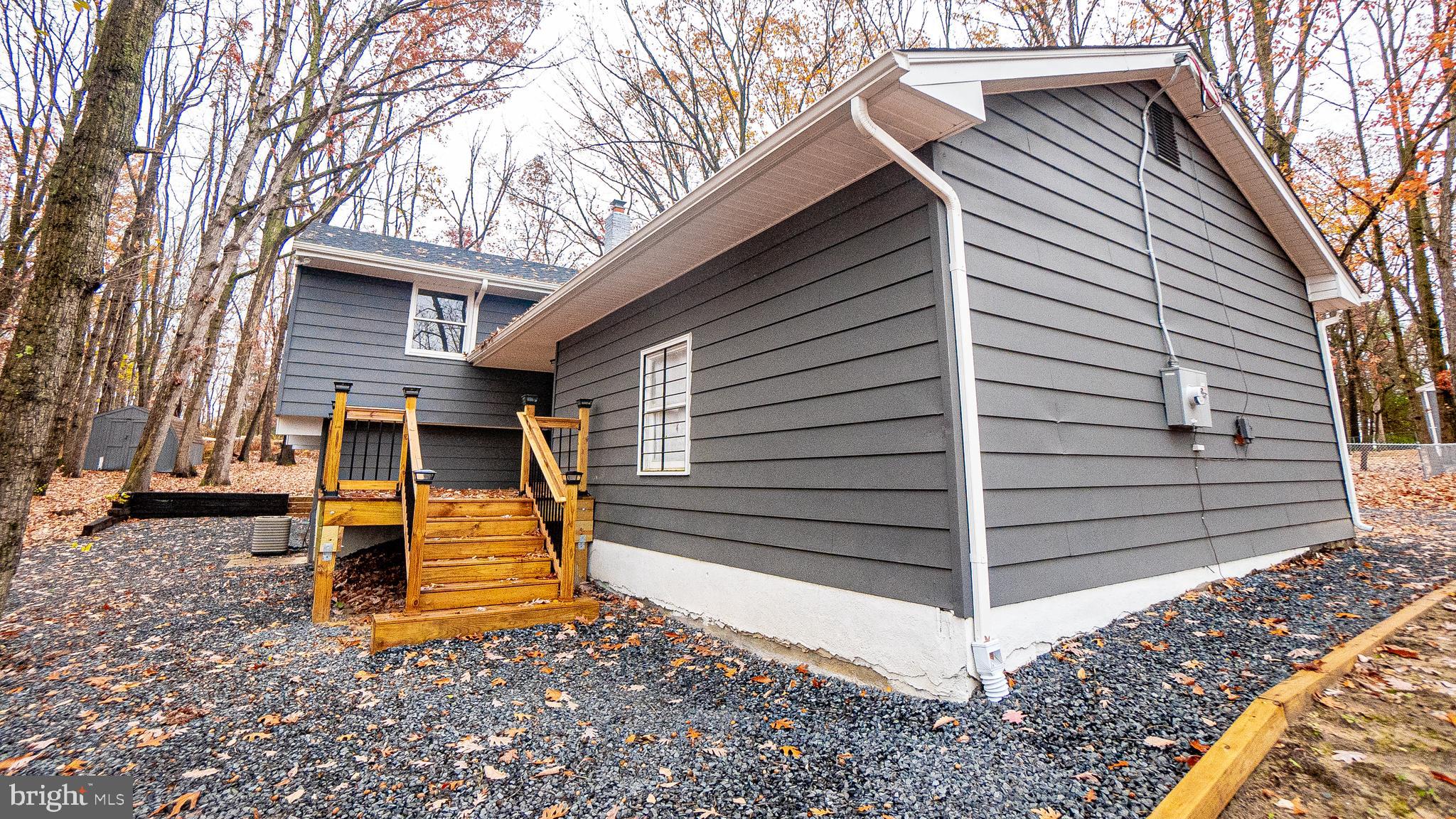 2306 Peter Cheeseman Road Sicklerville, NJ 08081 - Photo 2 of 26 a view of a house with a back yard