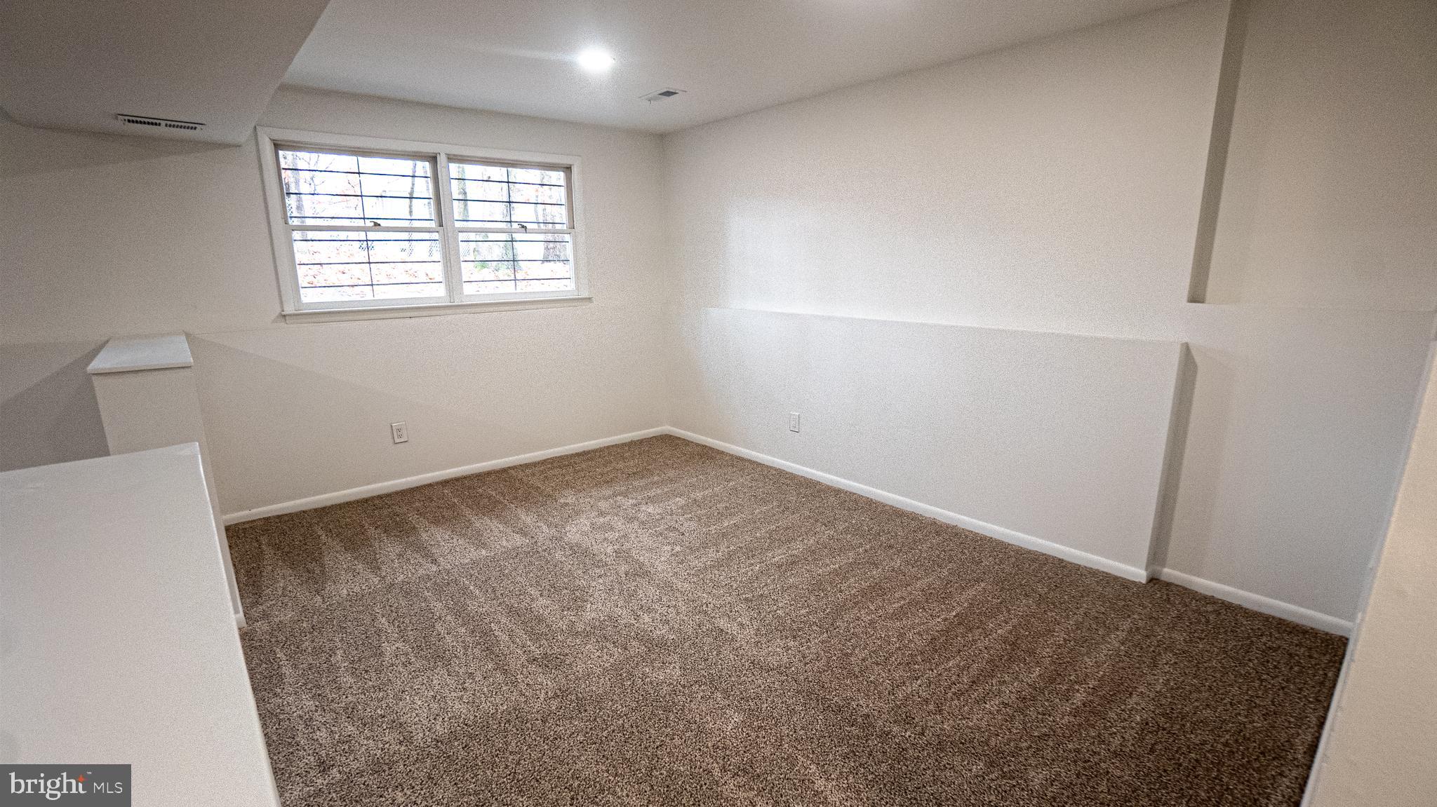 2306 Peter Cheeseman Road Sicklerville, NJ 08081 - Photo 21 of 26 an empty room with windows
