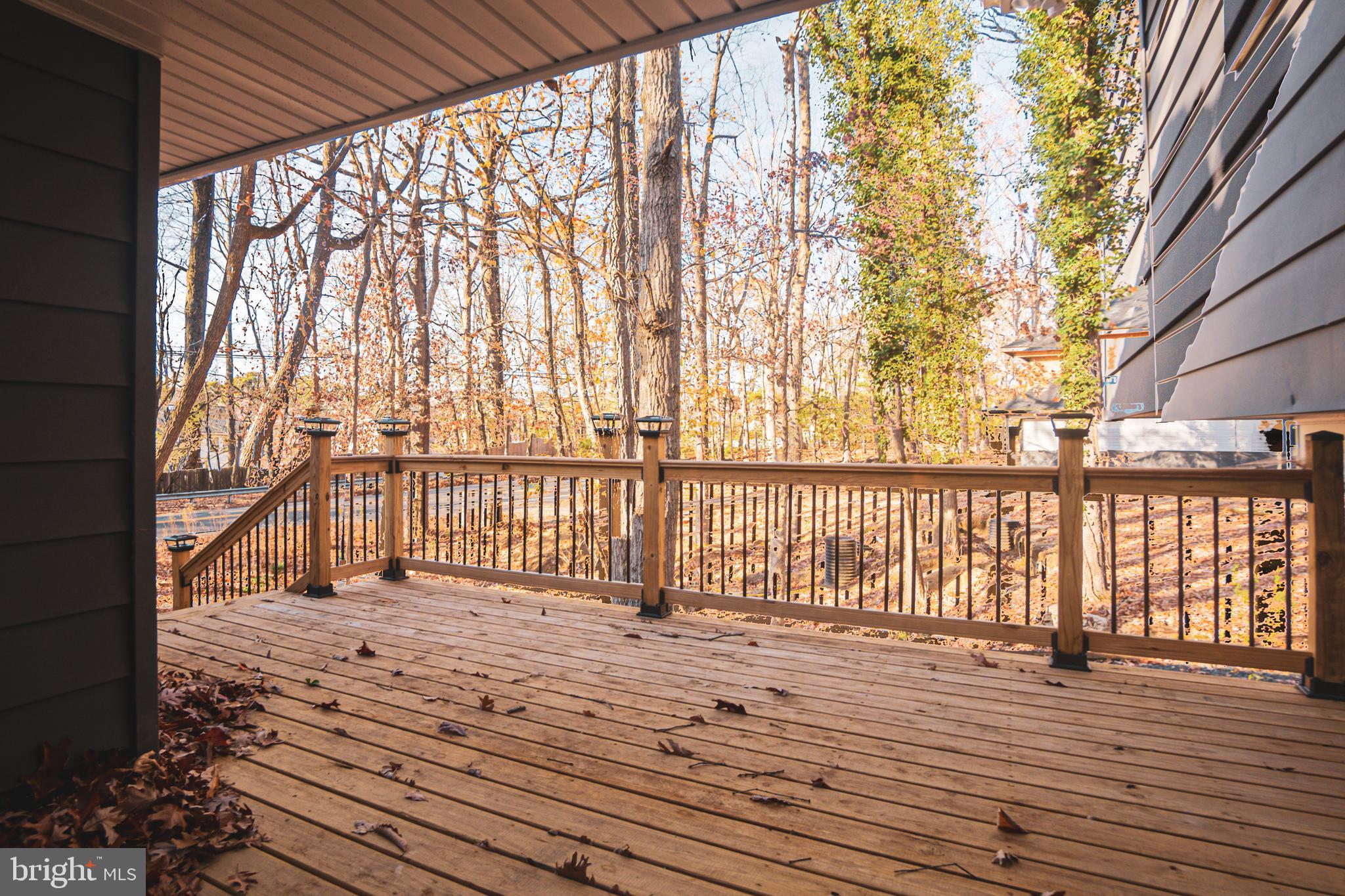 2306 Peter Cheeseman Road Sicklerville, NJ 08081 - Photo 6 of 26 a view of a balcony with wooden floor