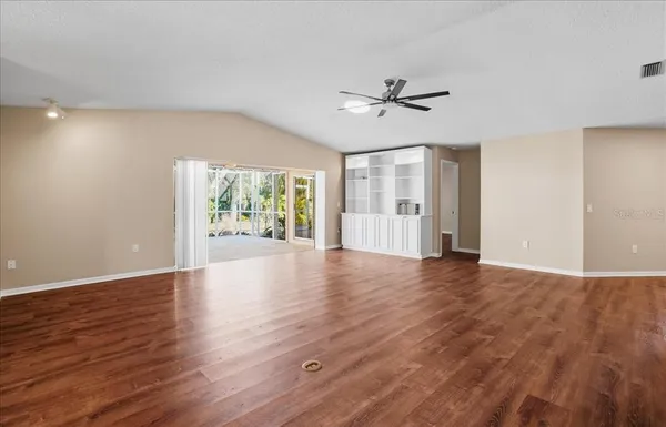 a kitchen with stainless steel appliances granite countertop a refrigerator stove and microwave