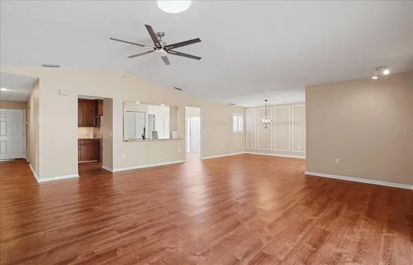 a kitchen with granite countertop a sink stainless steel appliances and counter space