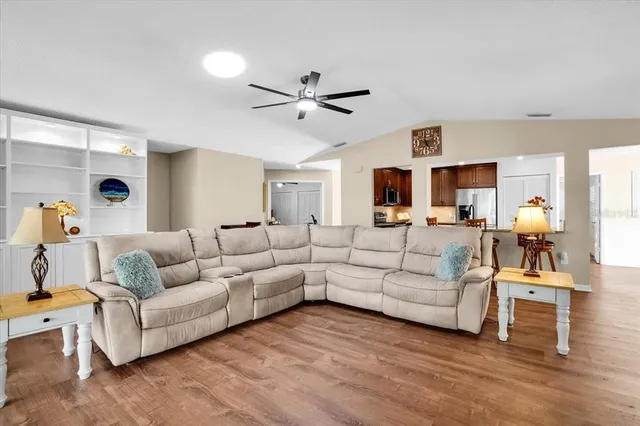 a kitchen with stainless steel appliances granite countertop a refrigerator stove and microwave