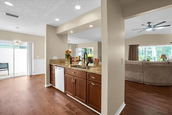 a bathroom with a granite countertop double vanity sinks and a mirror