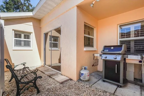 a view of a chairs and table in a patio