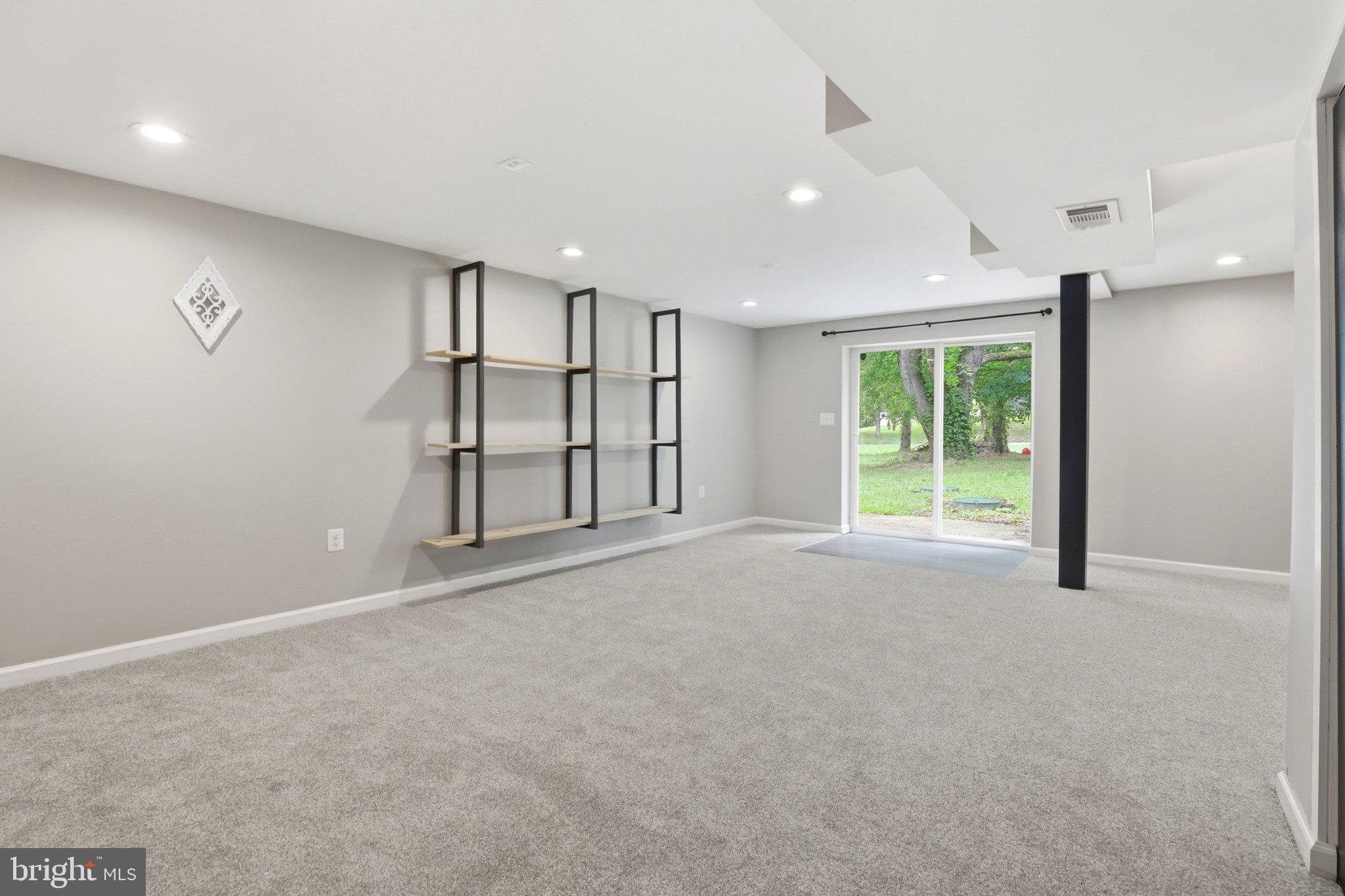 941 Pat Lane Huntingtown, MD 20639 - Photo 19 of 30 Spacious, light-filled basement retreat.
