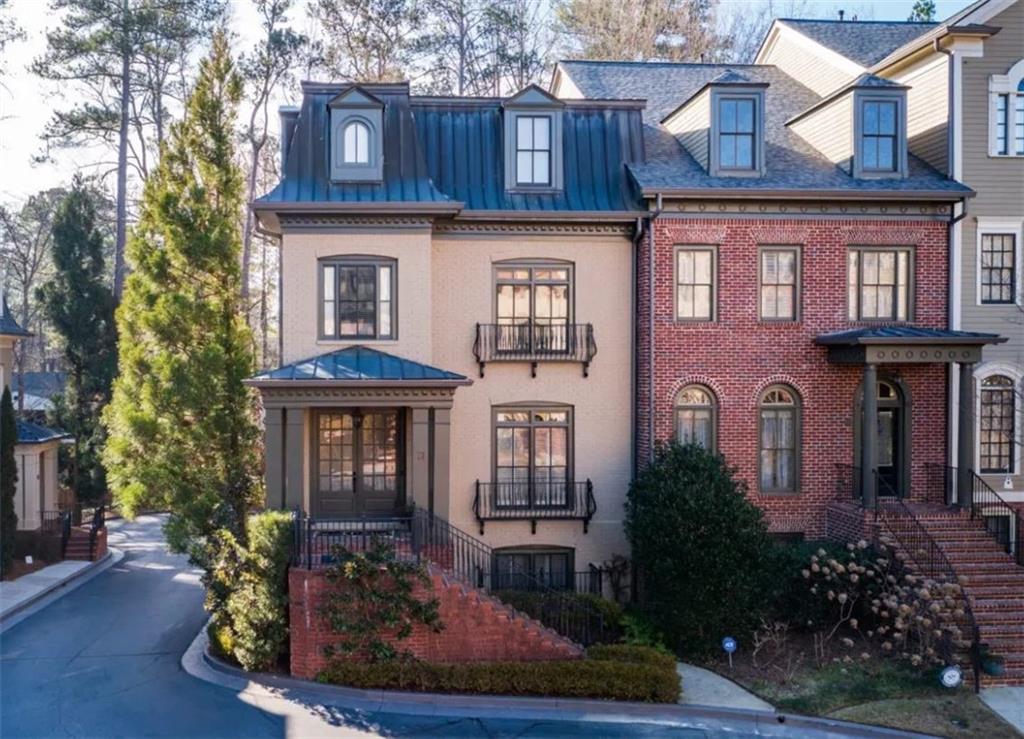 3127 Lenox Road Northeast, Unit 27 Atlanta, GA 30324 - Photo 1 of 1 a front view of a building with garden