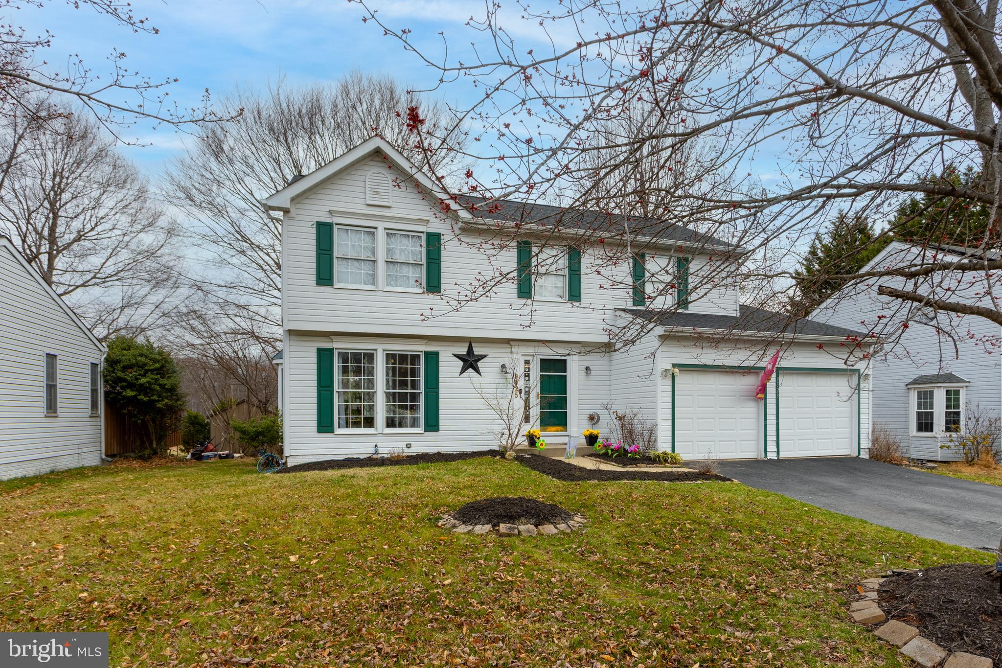 9525 Queens Guard Court Laurel, MD 20723 - Photo 1 of 36 a front view of a house with a yard