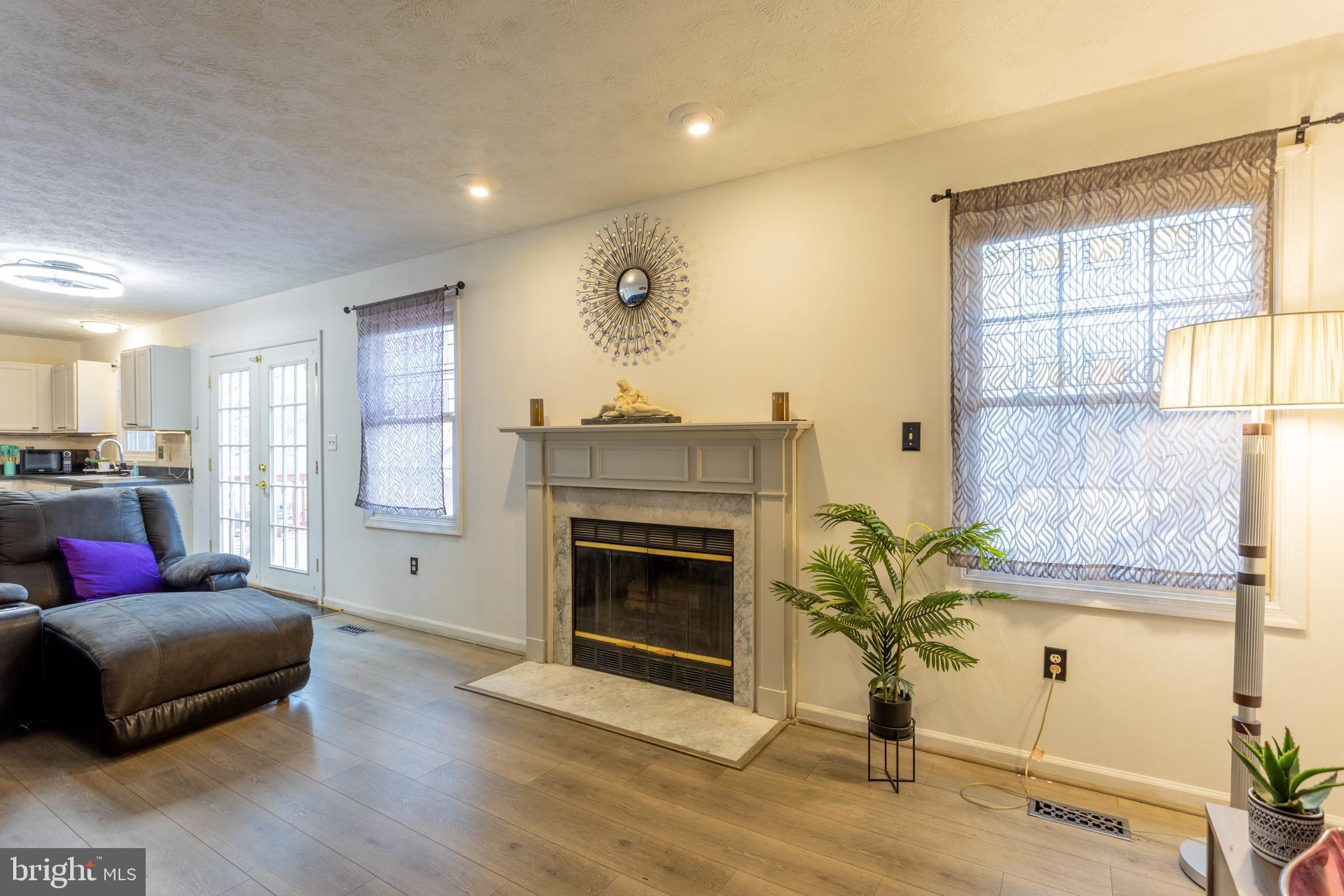 9525 Queens Guard Court Laurel, MD 20723 - Photo 12 of 36 a living room with furniture and a fireplace