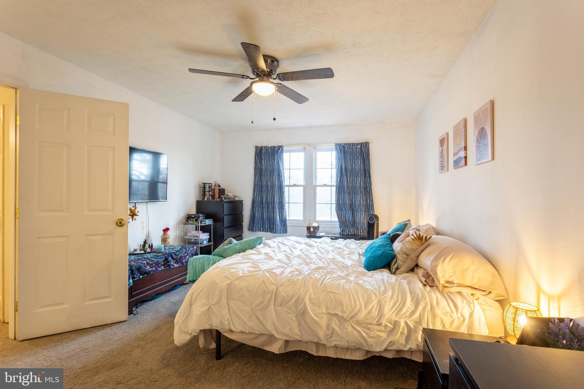 9525 Queens Guard Court Laurel, MD 20723 - Photo 17 of 36 a bedroom with a bed and window