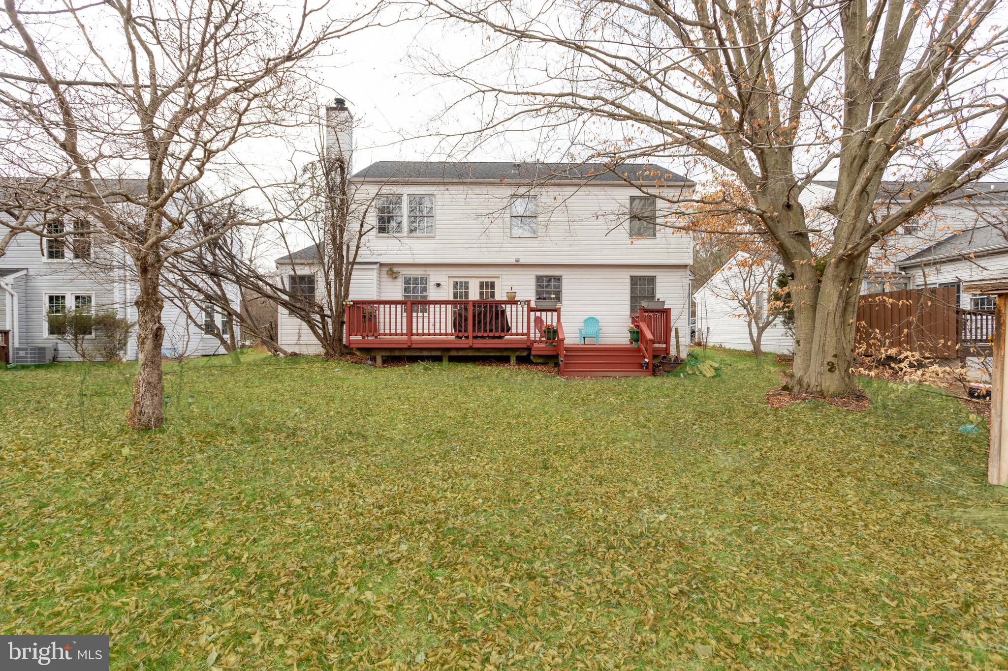 9525 Queens Guard Court Laurel, MD 20723 - Photo 32 of 36 a view of a house with a big yard and large tree