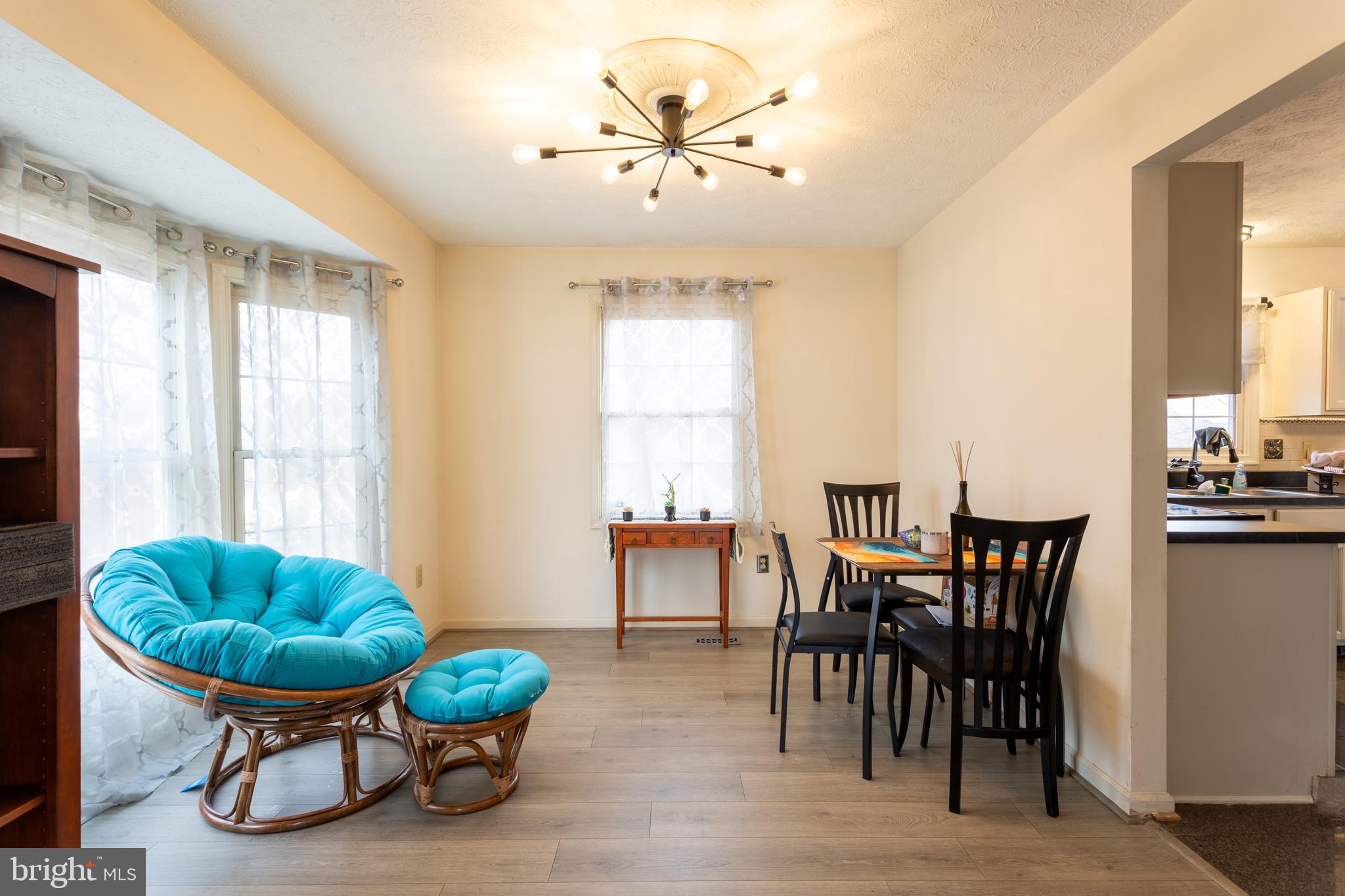9525 Queens Guard Court Laurel, MD 20723 - Photo 5 of 36 a living room with furniture a table and a large window