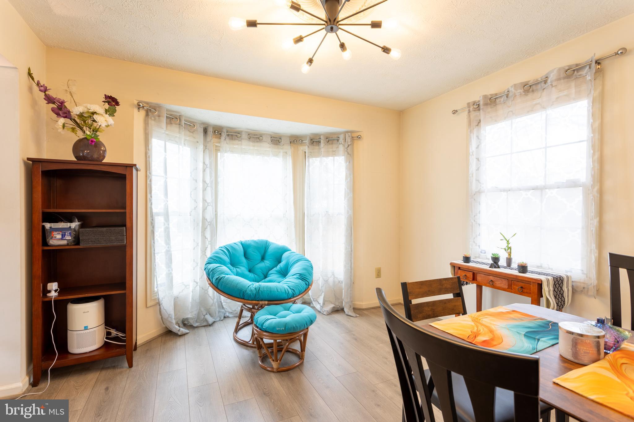 9525 Queens Guard Court Laurel, MD 20723 - Photo 6 of 36 a view of a dining room with furniture window and wooden floor