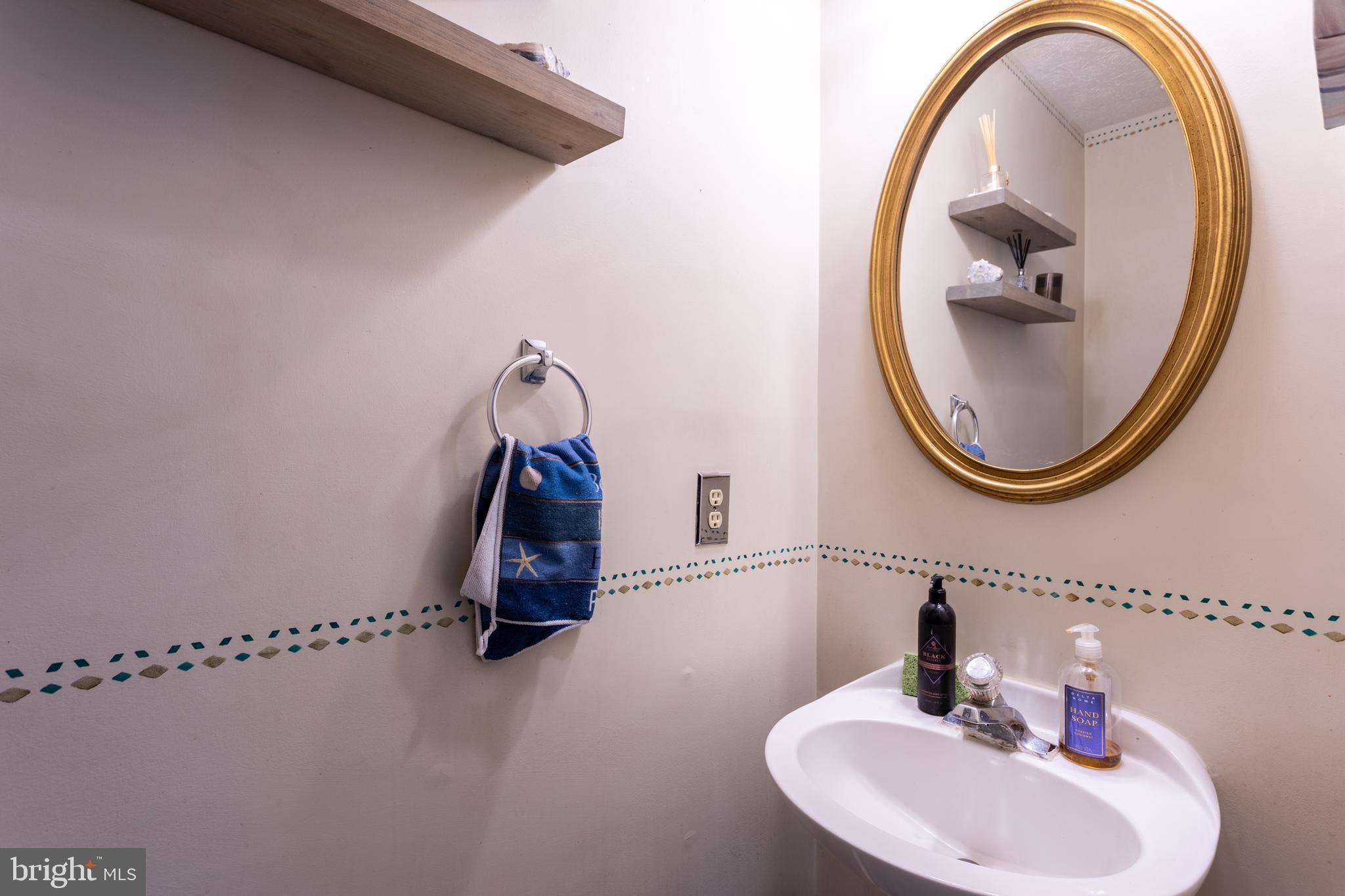 9525 Queens Guard Court Laurel, MD 20723 - Photo 8 of 36 a bathroom with a sink and mirror