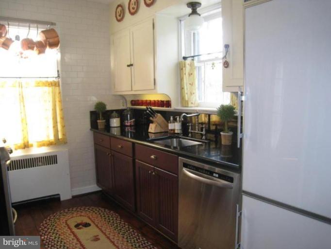 331 Paddington Road Baltimore, MD 21212 - Photo 22 of 30 a kitchen with granite countertop a sink stainless steel appliances and cabinets