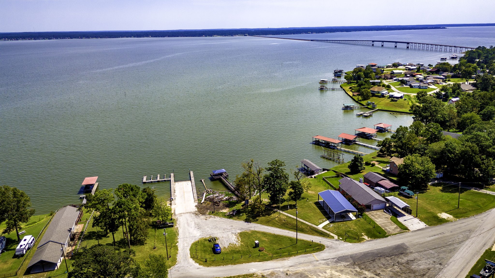 151 Key Largo Loop Point Blank, TX 77364 - Photo 47 of 49 Aerial view showcases the community boat ramp and dock, offering convenient access to the lake and endless recreational opporunities.
