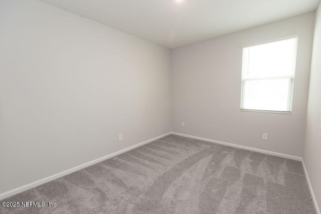 14655 Macadamia Lane Jacksonville, FL 32218 - Photo 15 of 24 an empty room with a window