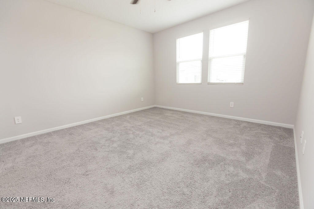 14655 Macadamia Lane Jacksonville, FL 32218 - Photo 17 of 24 an empty room with a window