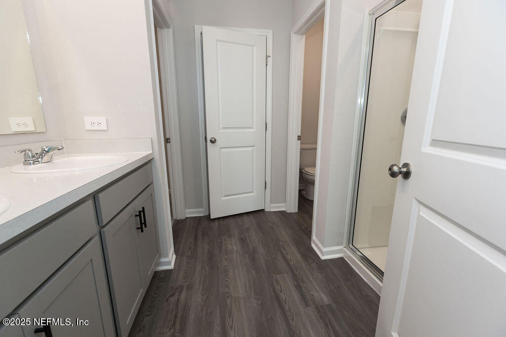 14655 Macadamia Lane Jacksonville, FL 32218 - Photo 18 of 24 a bathroom with a sink and a mirror