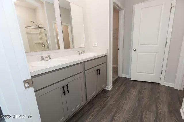 a bathroom with a sink and a mirror
