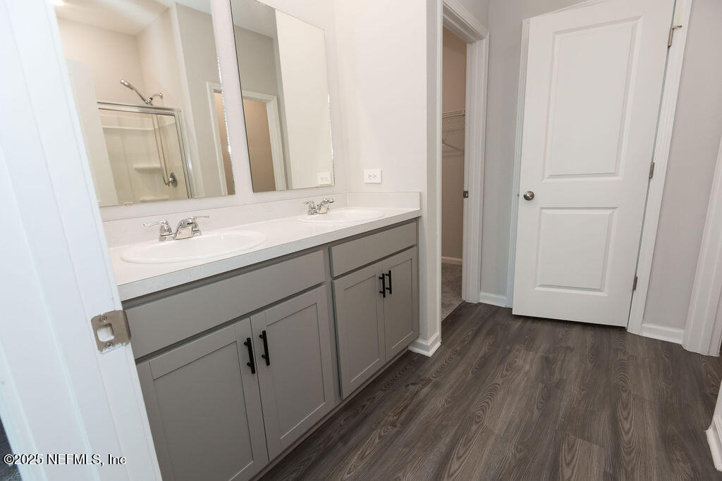 14655 Macadamia Lane Jacksonville, FL 32218 - Photo 19 of 24 a bathroom with a sink and a mirror