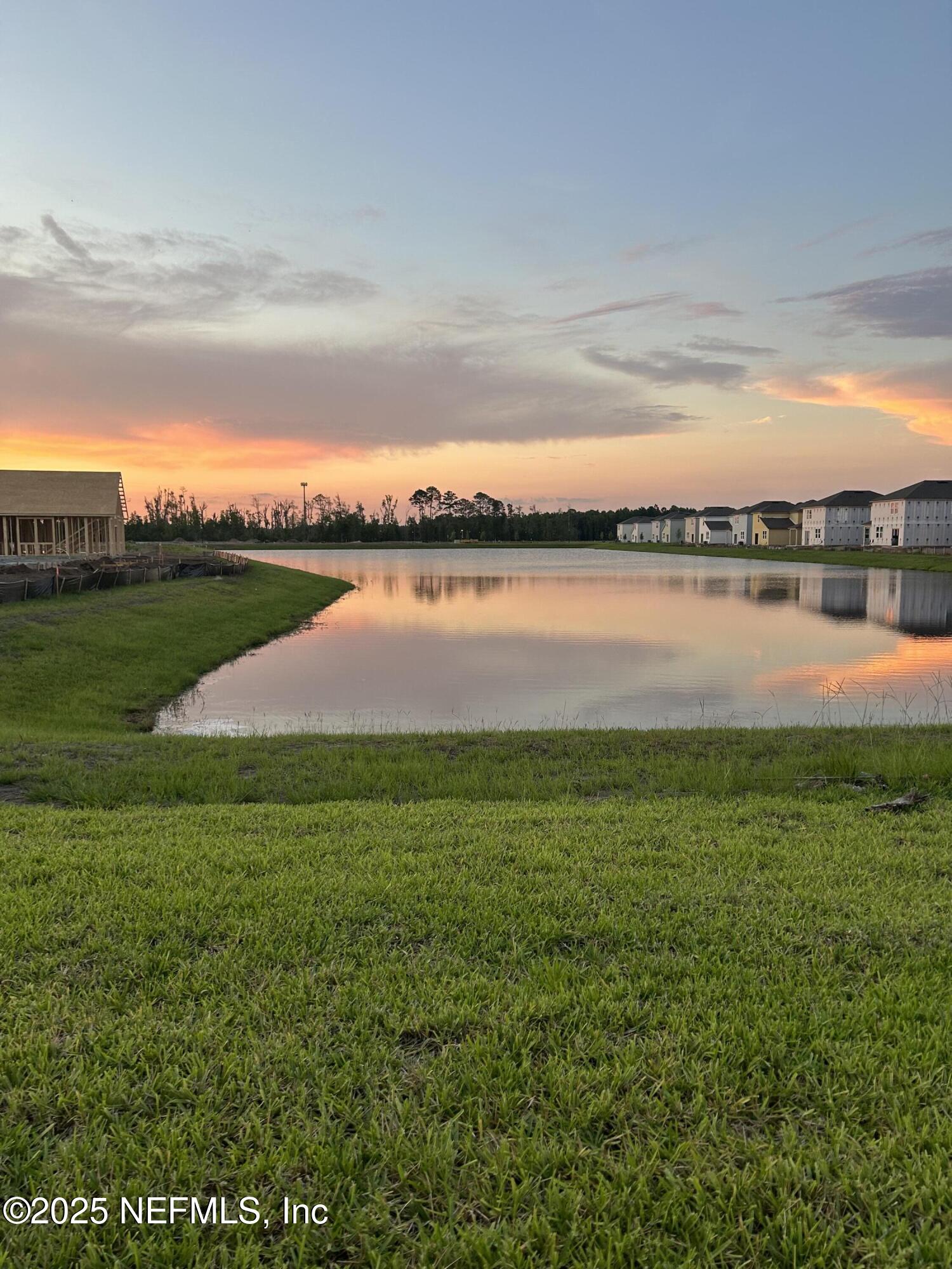14655 Macadamia Lane Jacksonville, FL 32218 - Photo 2 of 24 a view of a lake from a yard