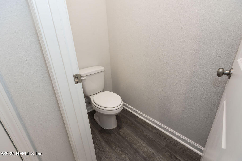 14655 Macadamia Lane Jacksonville, FL 32218 - Photo 21 of 24 a white toilet sitting next to a sink