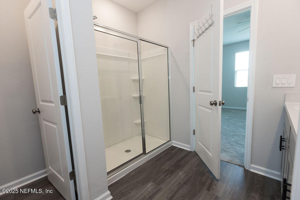 14655 Macadamia Lane Jacksonville, FL 32218 - Photo 22 of 24 a bathroom with a glass shower door