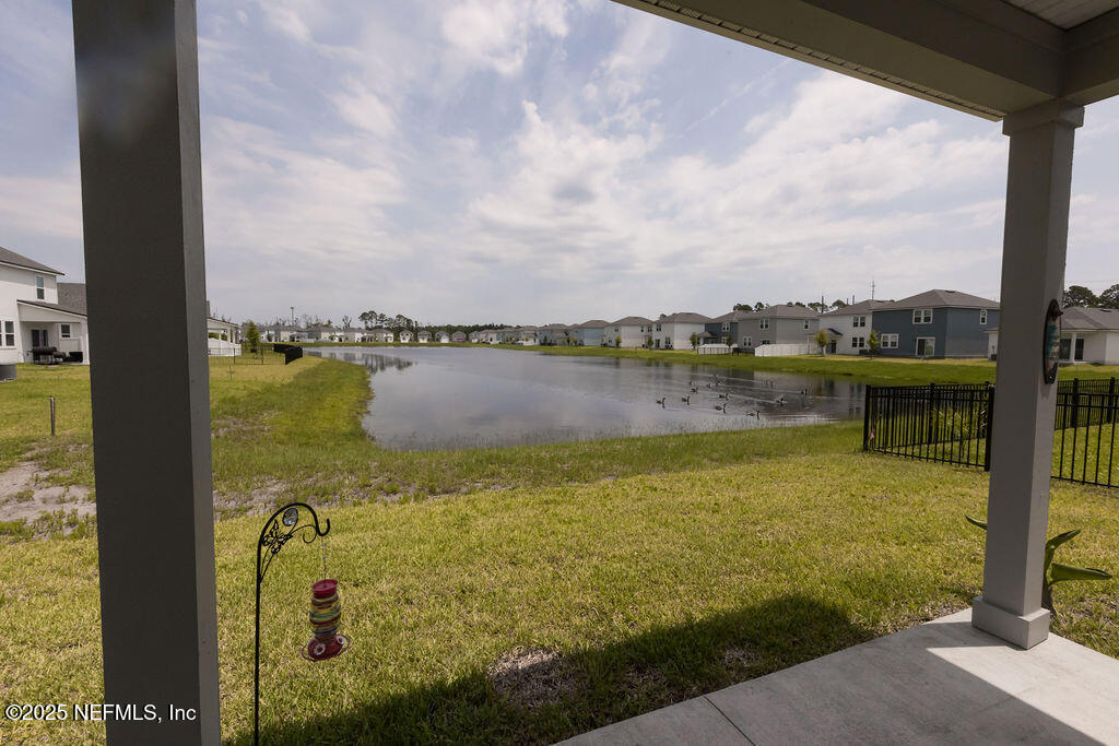 14655 Macadamia Lane Jacksonville, FL 32218 - Photo 23 of 24 a view of a lake with a big yard