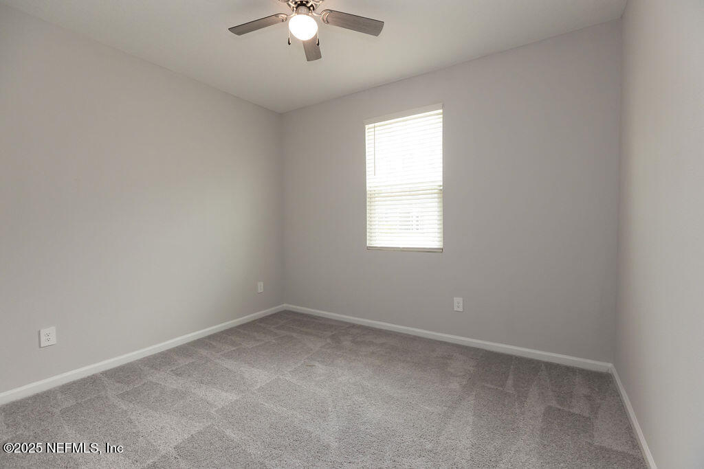 14655 Macadamia Lane Jacksonville, FL 32218 - Photo 7 of 24 an empty room with a window