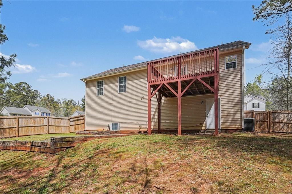 10 Wilbur Way Covington, GA 30016 - Photo 21 of 22 a view of house with wooden fence