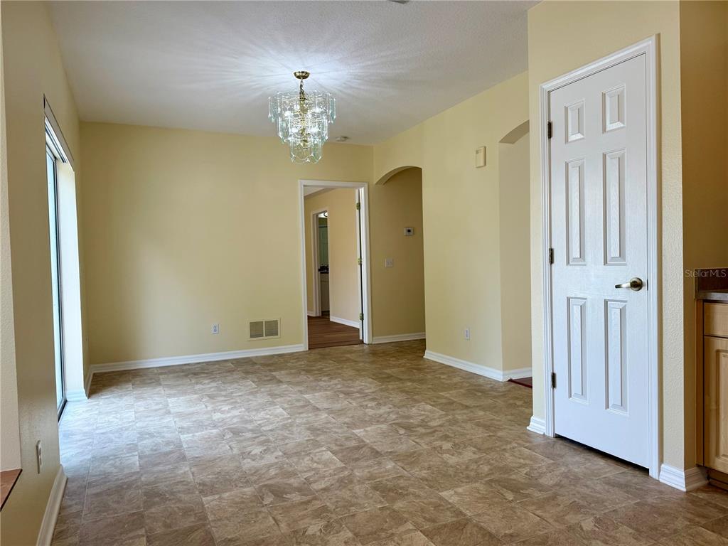 2521 Maylin Drive Trinity, FL 34655 - Photo 13 of 30 a view of an empty room with a chandelier
