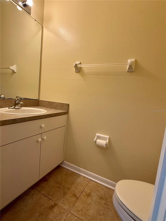 2521 Maylin Drive Trinity, FL 34655 - Photo 18 of 30 a bathroom with a sink a toilet and a mirror