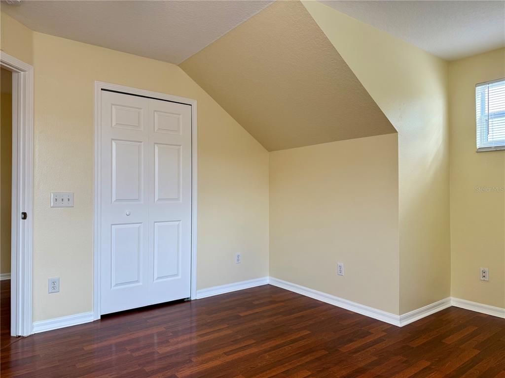 2521 Maylin Drive Trinity, FL 34655 - Photo 20 of 30 a view of an empty room with wooden floor