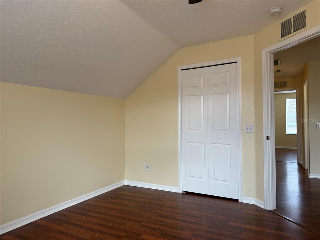 2521 Maylin Drive Trinity, FL 34655 - Photo 22 of 30 a view of an empty room with wooden floor