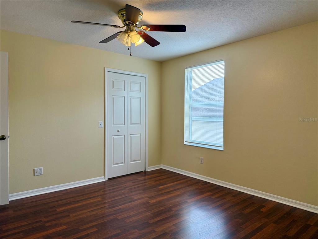 2521 Maylin Drive Trinity, FL 34655 - Photo 25 of 30 a view of room with hardwood floor and ceiling fan
