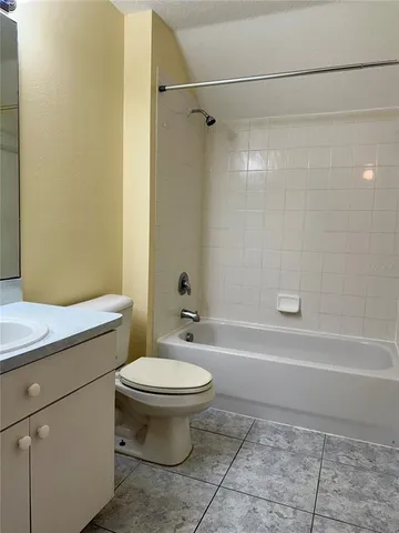 a bathroom with a sink a toilet and a bathtub