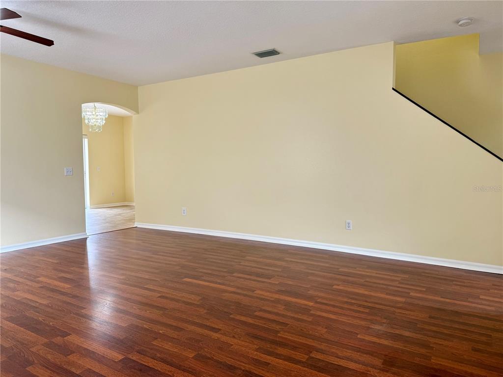 2521 Maylin Drive Trinity, FL 34655 - Photo 5 of 30 a view of an empty room with wooden floor