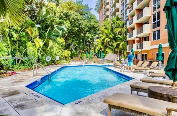 a view of a patio with table and chairs and potted plants