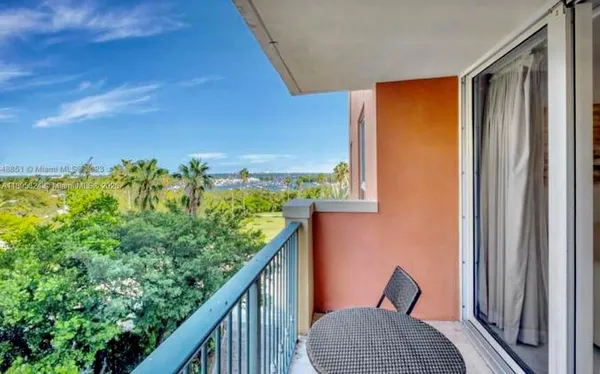 a living room with furniture and a lamp