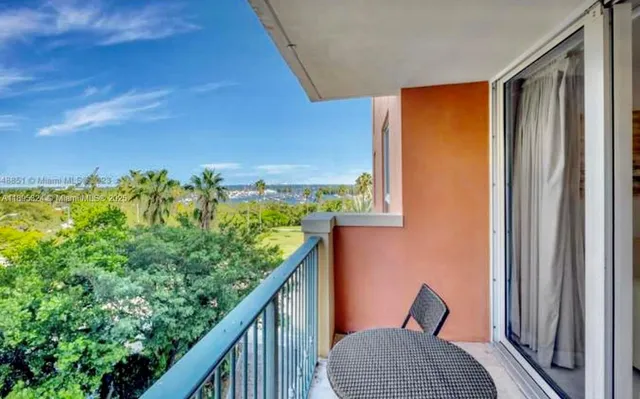 a living room with furniture and a lamp