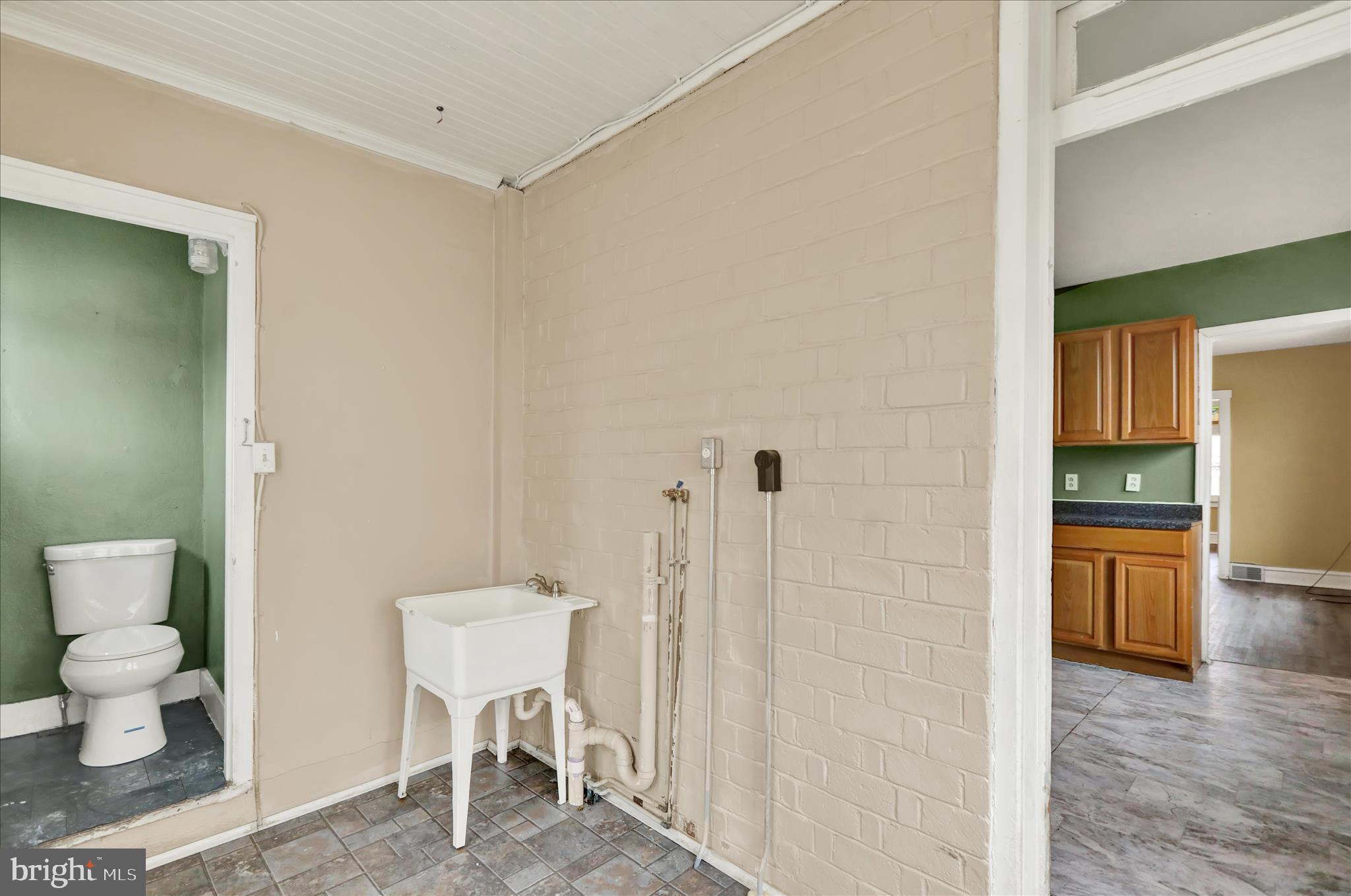 645 Lancaster Avenue Reading, PA 19611 - Photo 12 of 36 a bathroom with a toilet and a sink