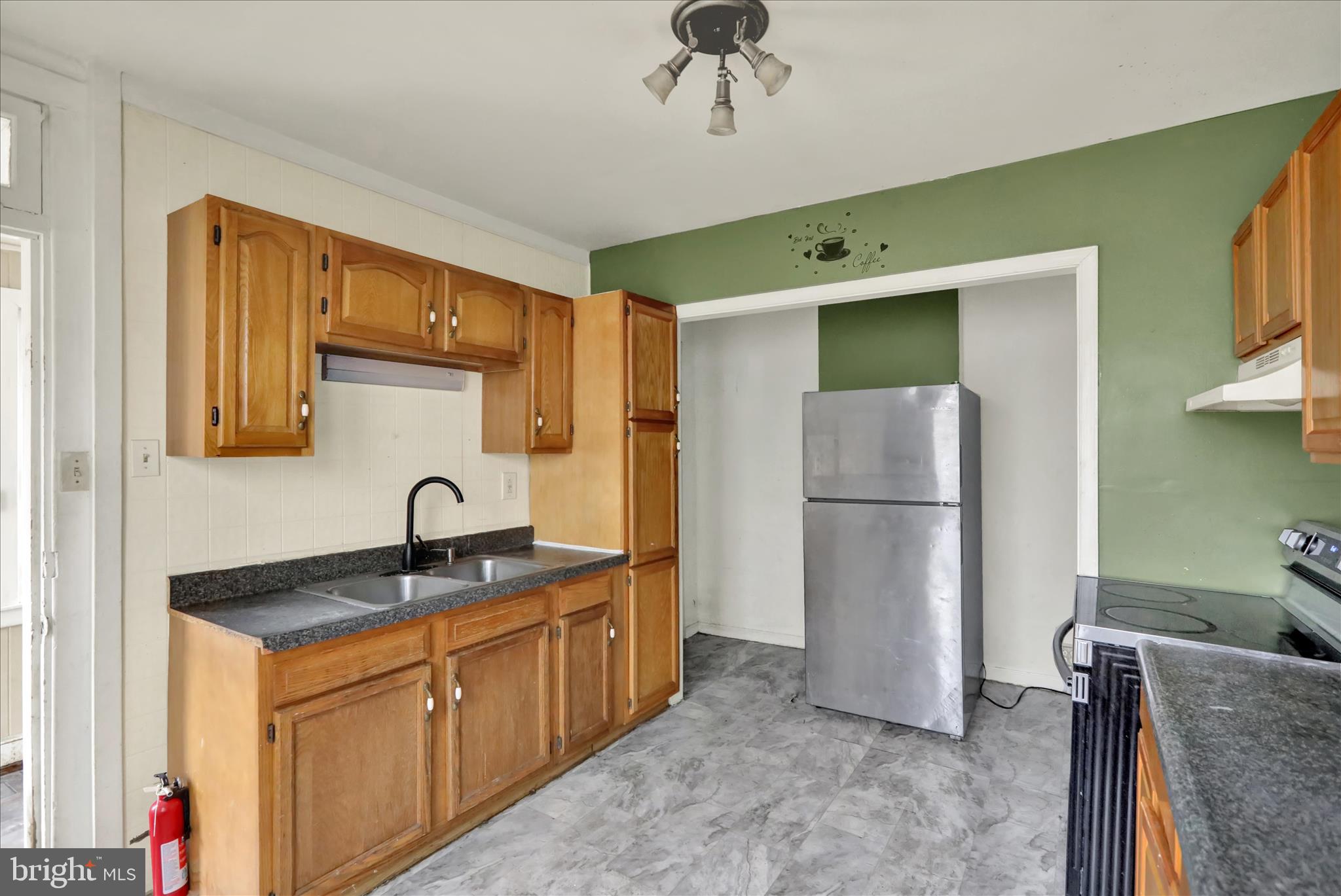 645 Lancaster Avenue Reading, PA 19611 - Photo 18 of 36 a kitchen with a refrigerator and a sink