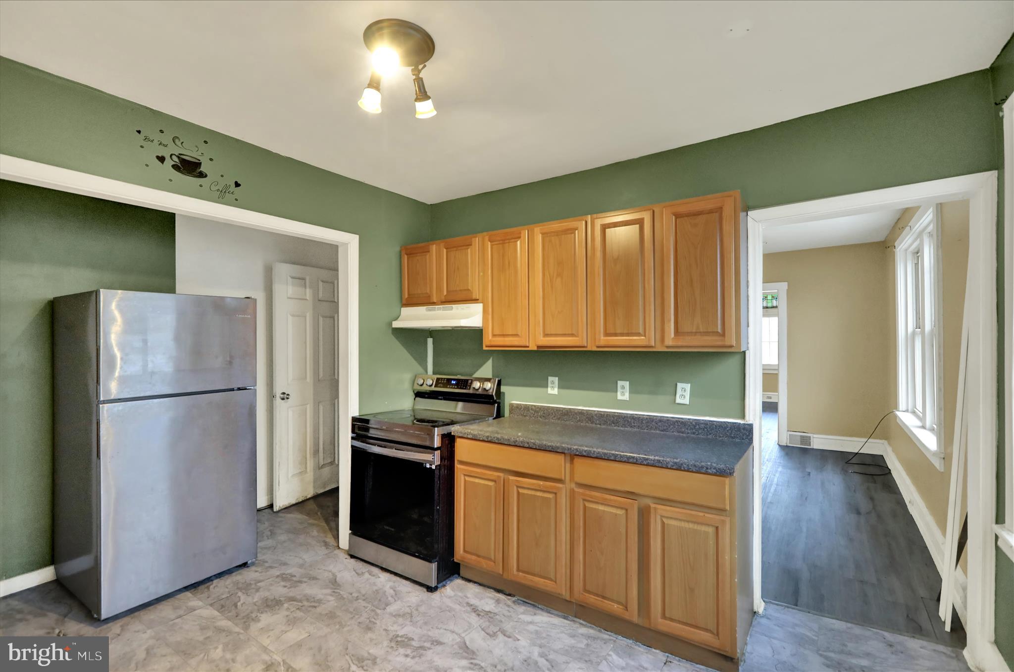 645 Lancaster Avenue Reading, PA 19611 - Photo 20 of 36 a kitchen with a refrigerator a stove top oven a sink and dishwasher