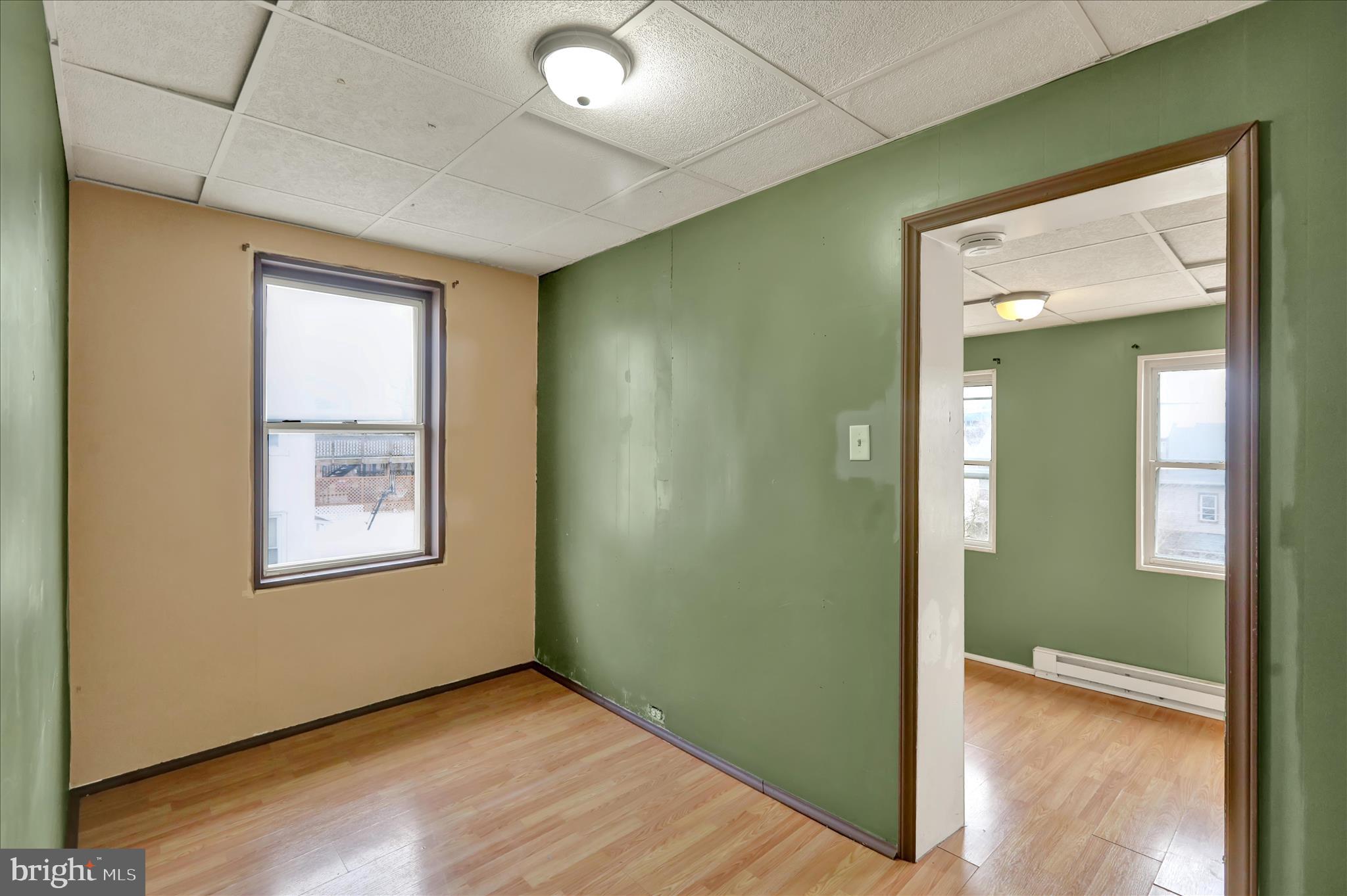 645 Lancaster Avenue Reading, PA 19611 - Photo 24 of 36 a view of an empty room with wooden floor and a window