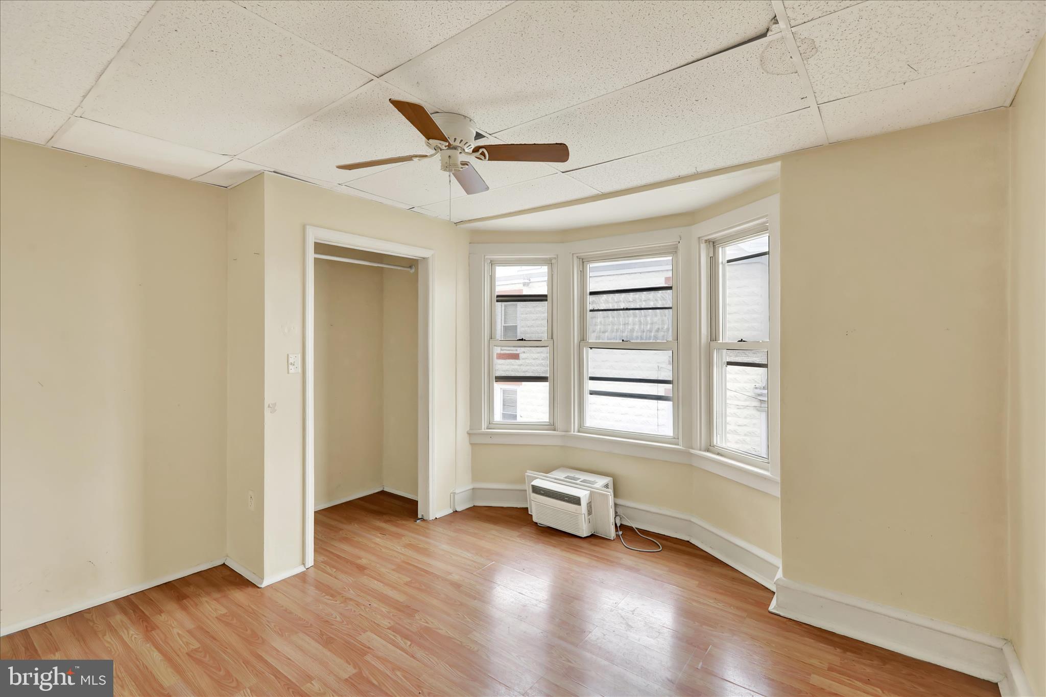 645 Lancaster Avenue Reading, PA 19611 - Photo 27 of 36 an empty room with wooden floor and windows
