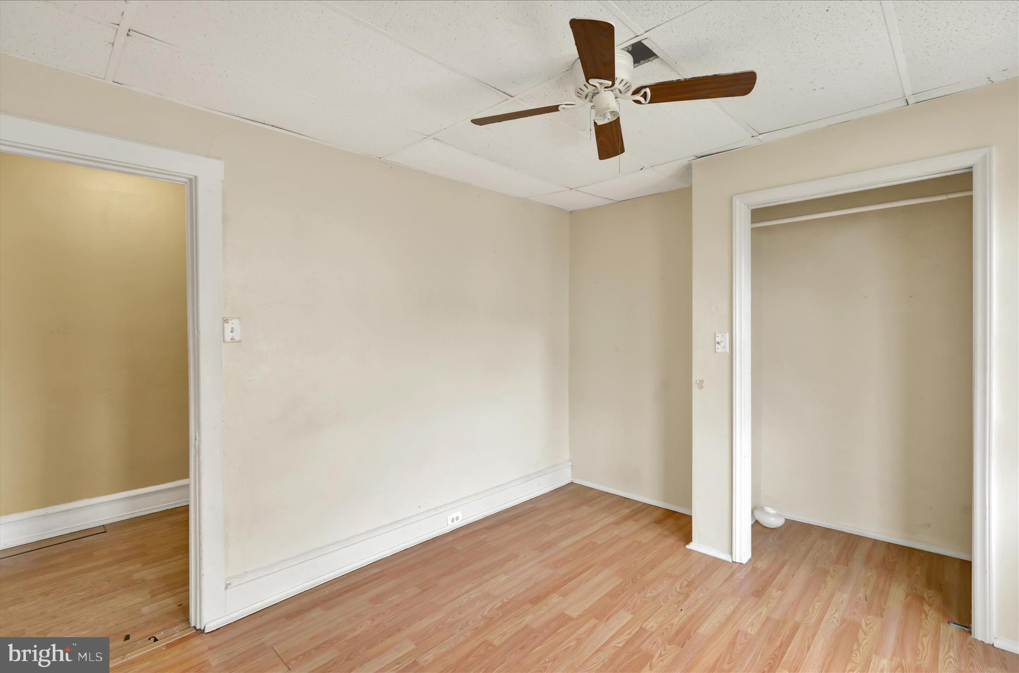 645 Lancaster Avenue Reading, PA 19611 - Photo 28 of 36 an empty room with wooden floor and a ceiling fan
