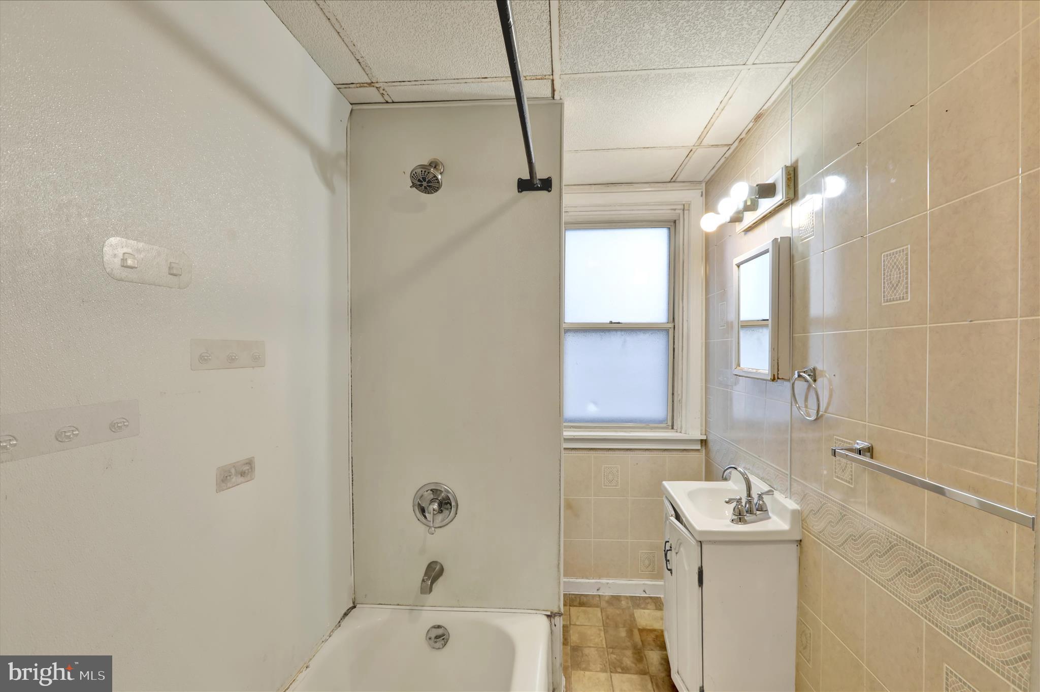 645 Lancaster Avenue Reading, PA 19611 - Photo 29 of 36 a bathroom with a sink a toilet and shower
