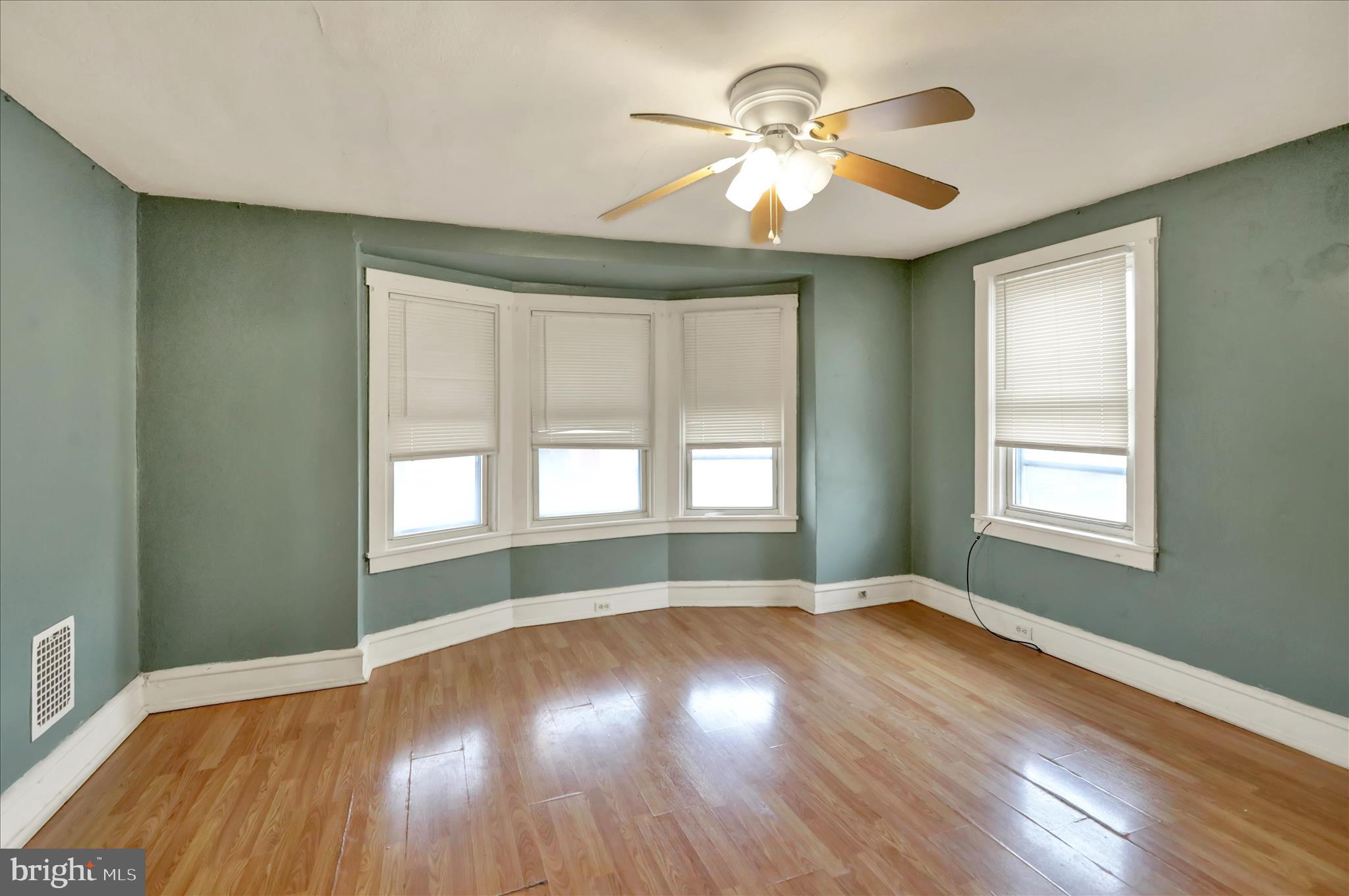 645 Lancaster Avenue Reading, PA 19611 - Photo 31 of 36 a view of empty room with wooden floor and fan