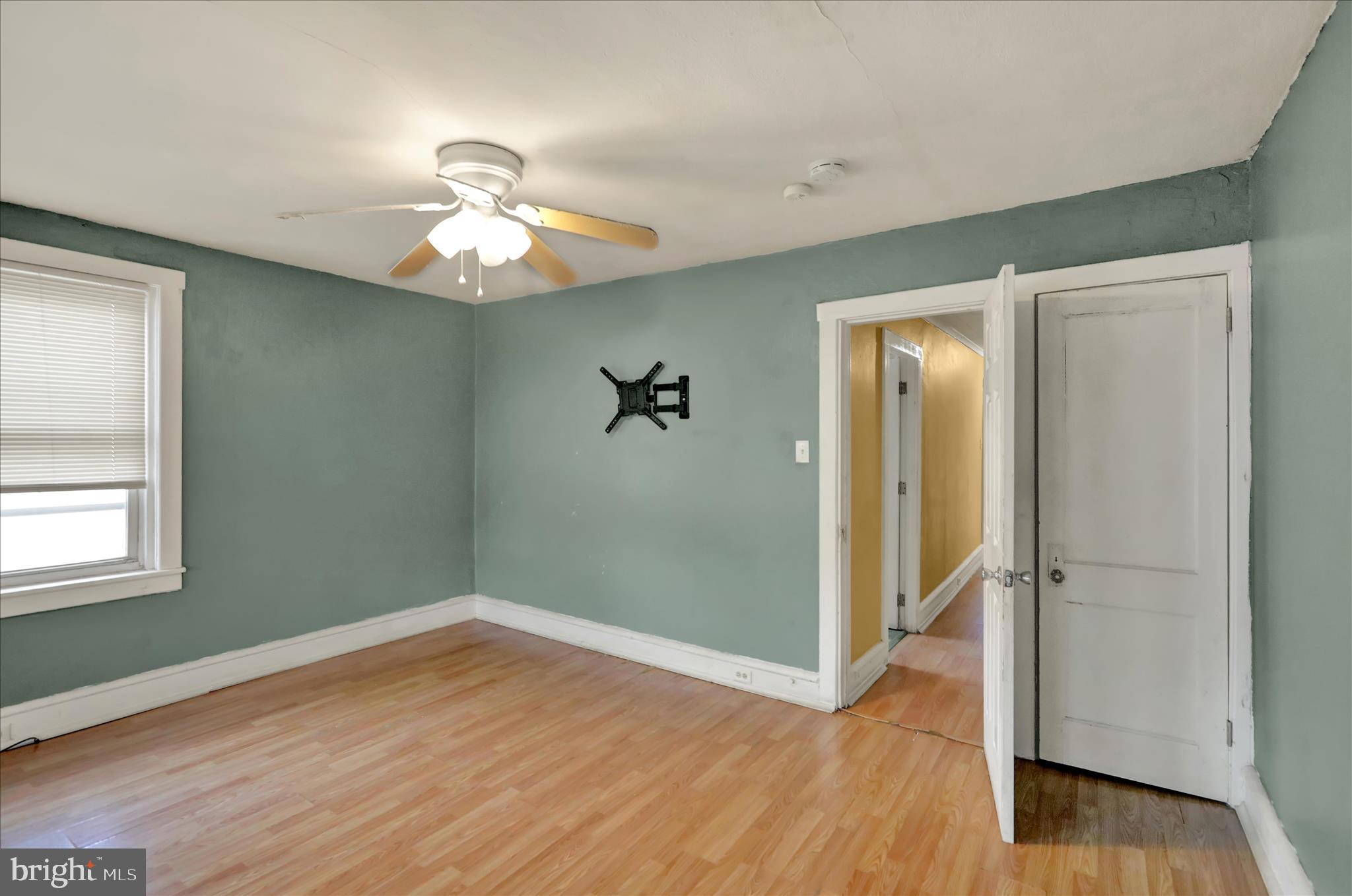 645 Lancaster Avenue Reading, PA 19611 - Photo 32 of 36 wooden floor in an empty room with a window