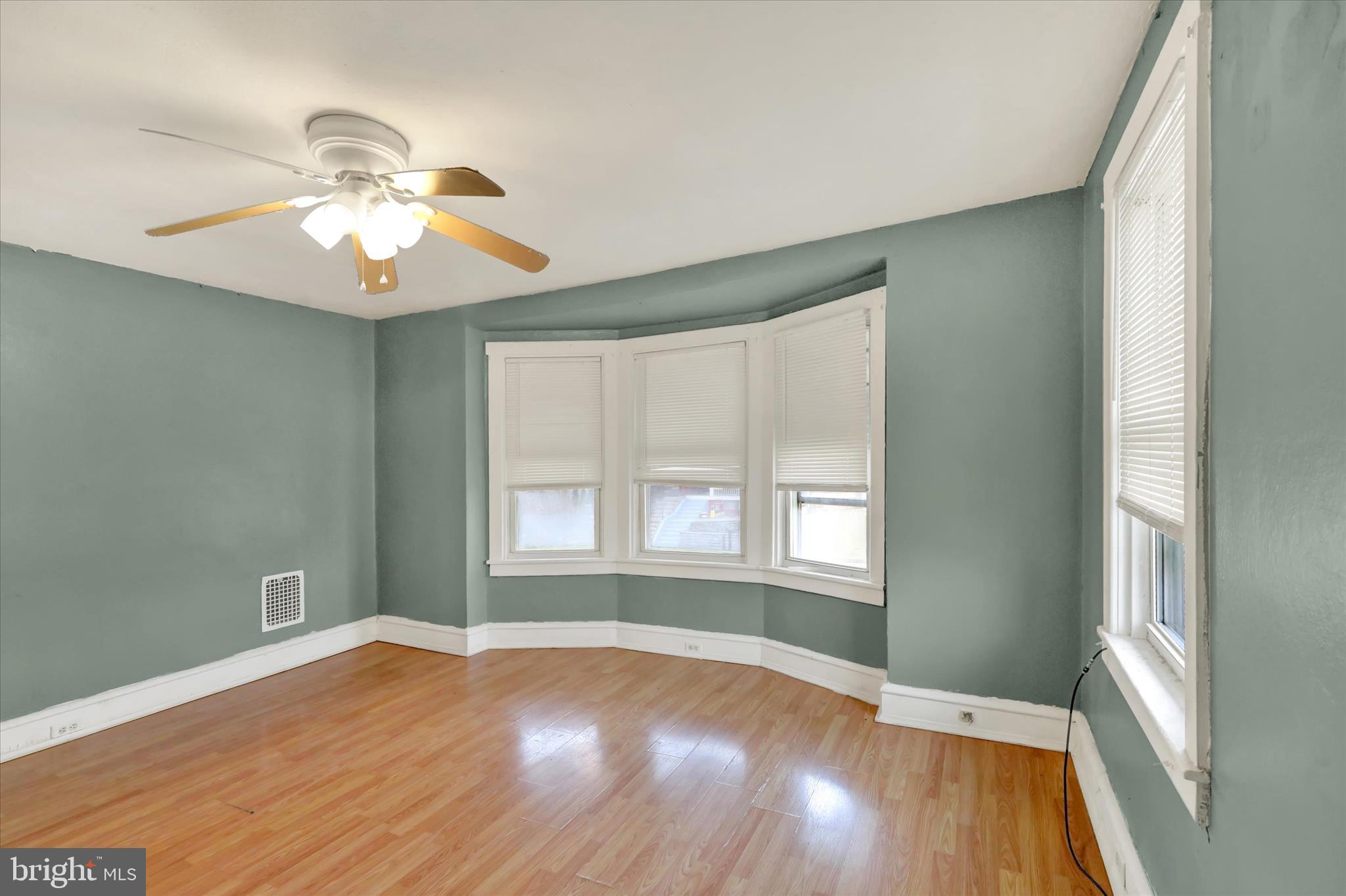 645 Lancaster Avenue Reading, PA 19611 - Photo 33 of 36 a view of empty room with wooden floor and fan